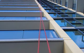 Vision Rope Access worker painting a tower in Burnaby, IRATA, Rope Access, Painting